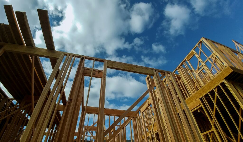 Close-up of gables roof on stick built home under construction and blue sky New build roof with