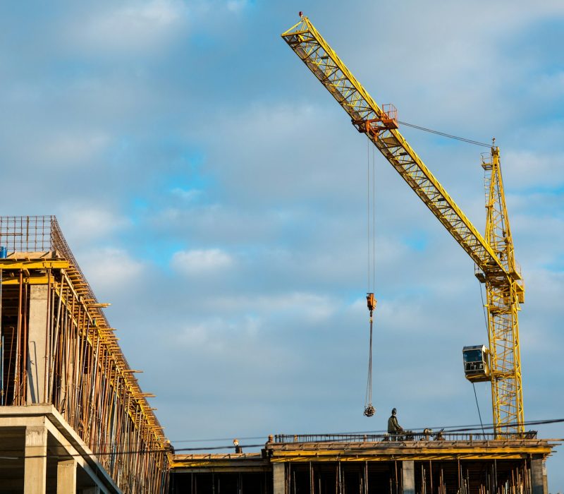 Building construction house with crane concept. Blue sky background.